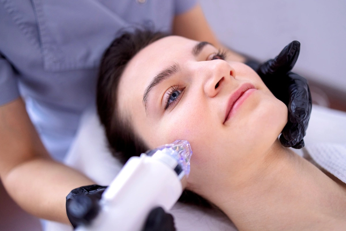 Professional performing Collagen Induction Therapy on face