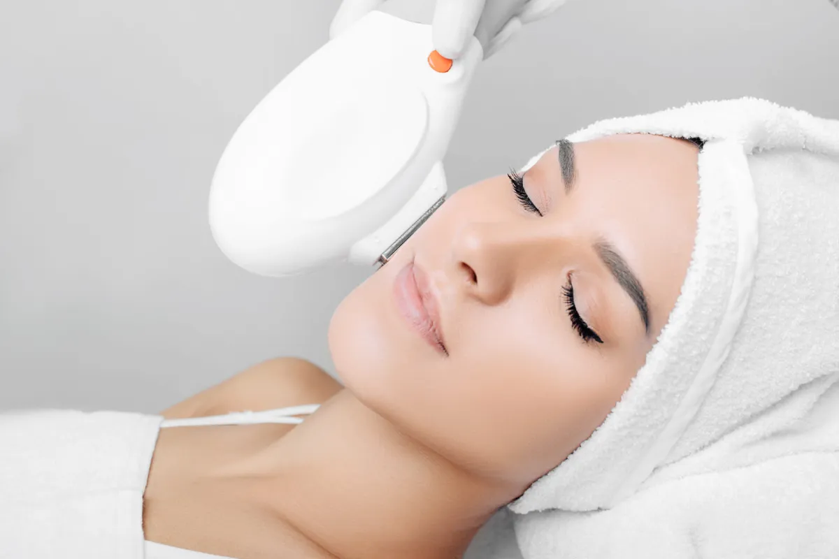 Woman receiving BBL HEROic treatment at Allure Dermatology